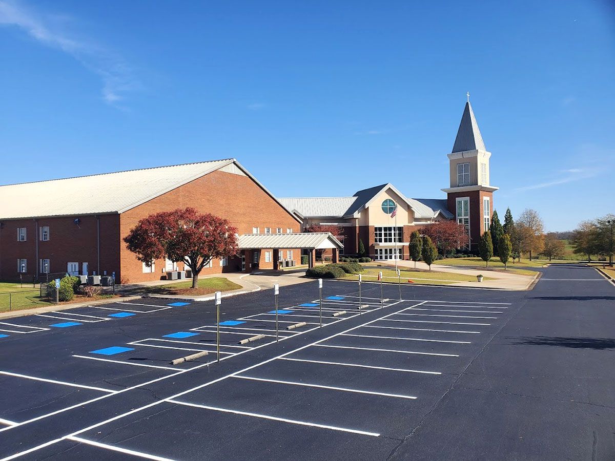 A newly paved parking lot in front of a church