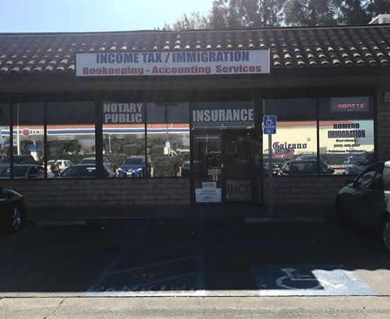 A building with a sign that says income tax / immigration