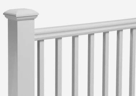 A white vinyl deck railing with vertical balusters and a square post topped with a decorative cap.