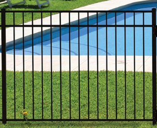 Black aluminum metal pool safety fence installed on green grass in front of a blue swimming pool.