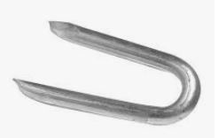 A U-shaped metal fence staple with two pointed ends for driving into wood.