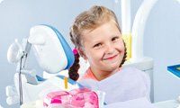 Little girl smiling during her dental check-up