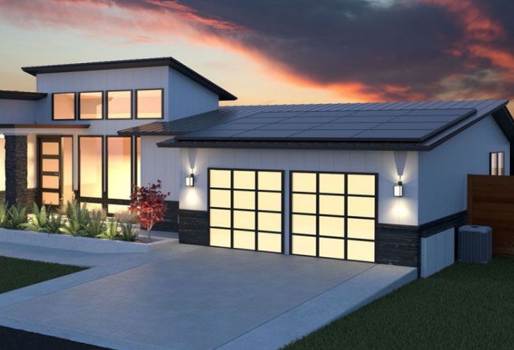 An artist 's impression of a modern house with solar panels on the roof
