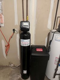 White salt pellets fill a water softener's tank. A yellow-filled cylinder is visible.