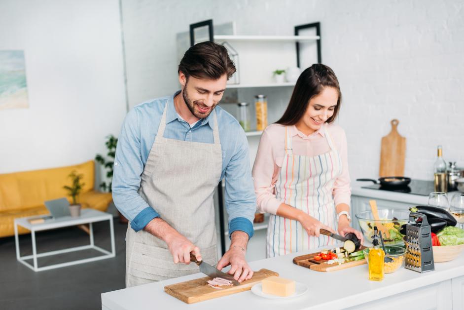 Couple cooking in kitchen