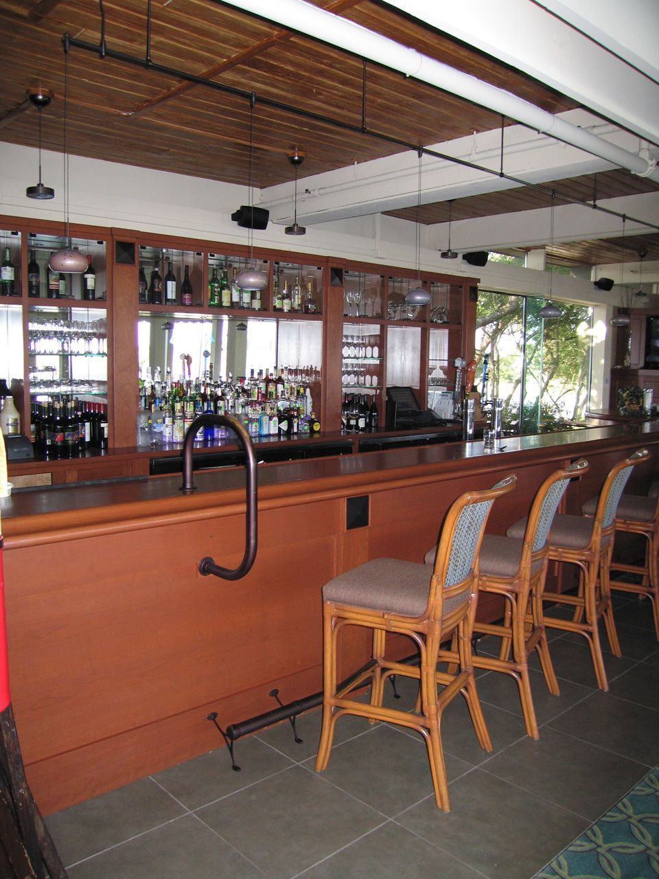 A bar with a lot of bottles on it