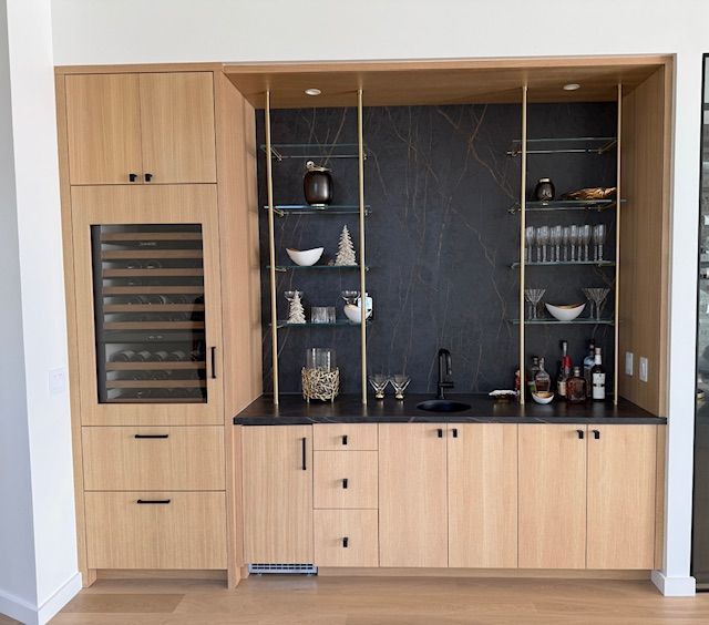 A kitchen with wooden cabinets and a wine cooler