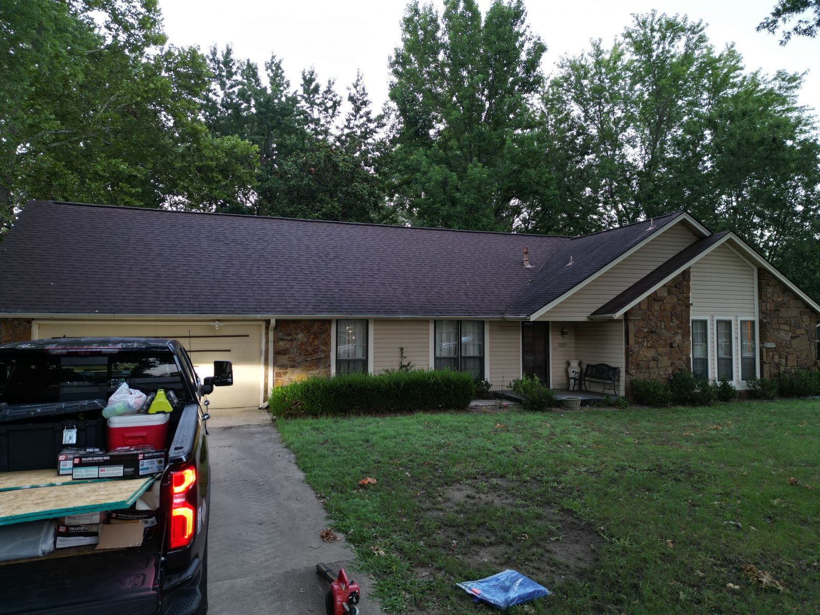 A house with a truck parked in front of it