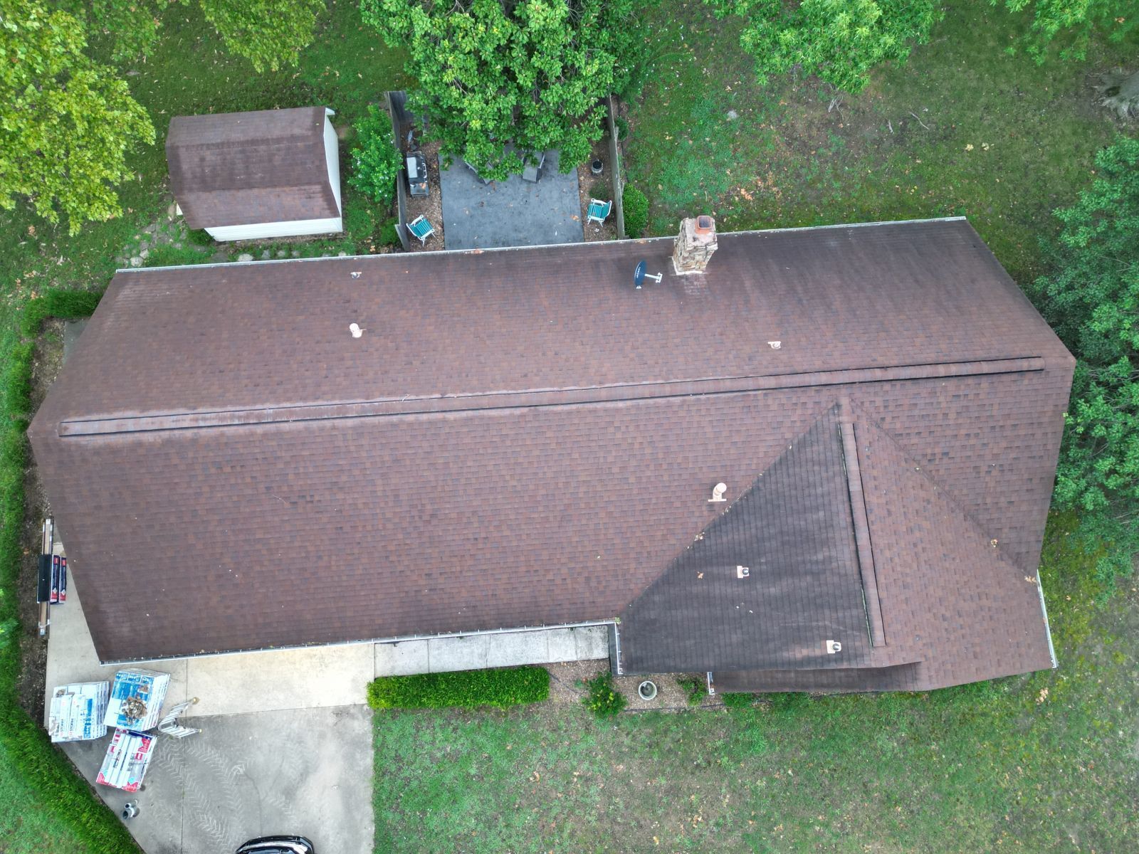 An aerial view of a house with a brown roof.