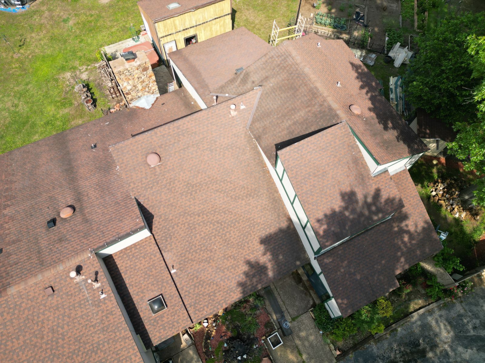 An aerial view of a house with a brown roof.
