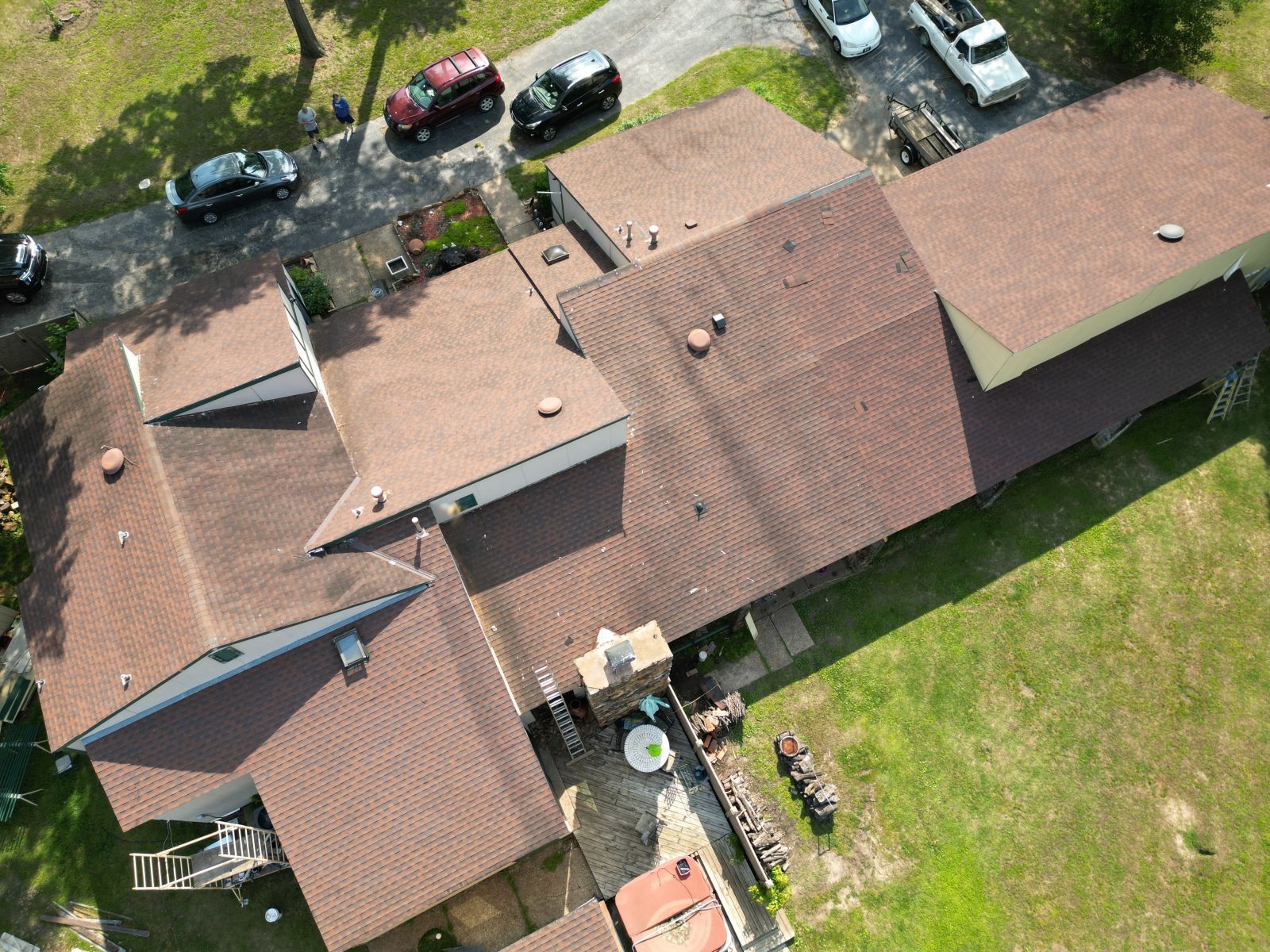 An aerial view of a house with a brown roof.