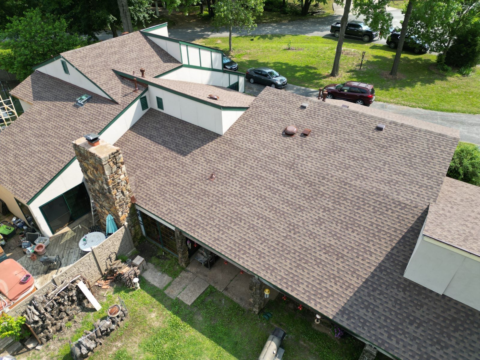 An aerial view of a house with a new roof.