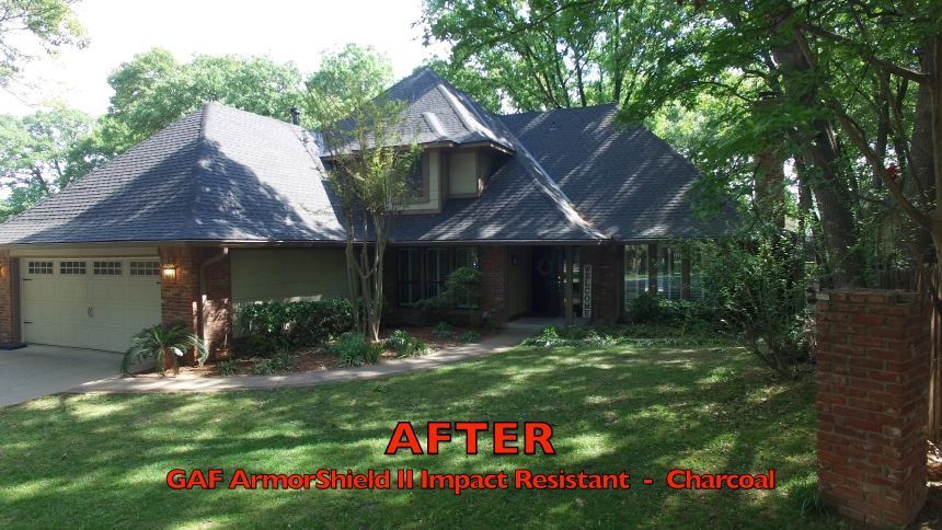 A large house with a roof that has been painted black