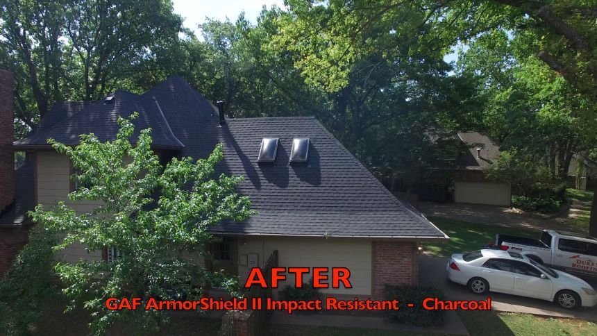 An aerial view of a house with a new roof.