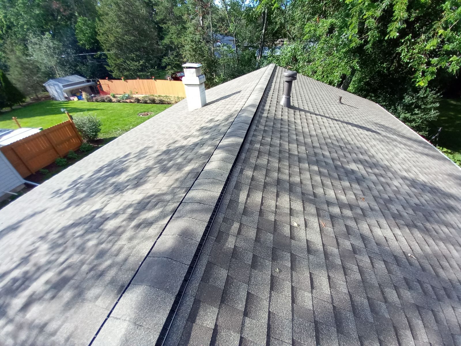 The roof of a house with a chimney on it