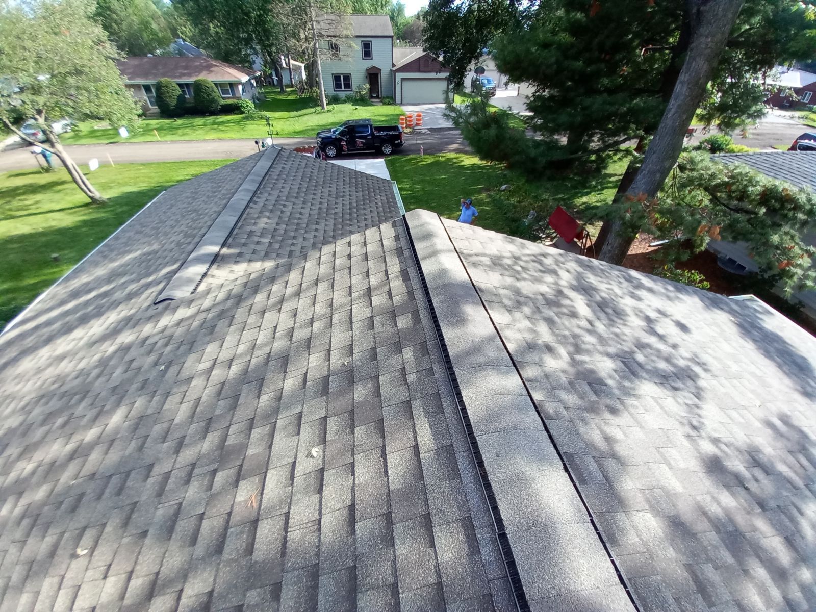 An aerial view of a roof in a residential area