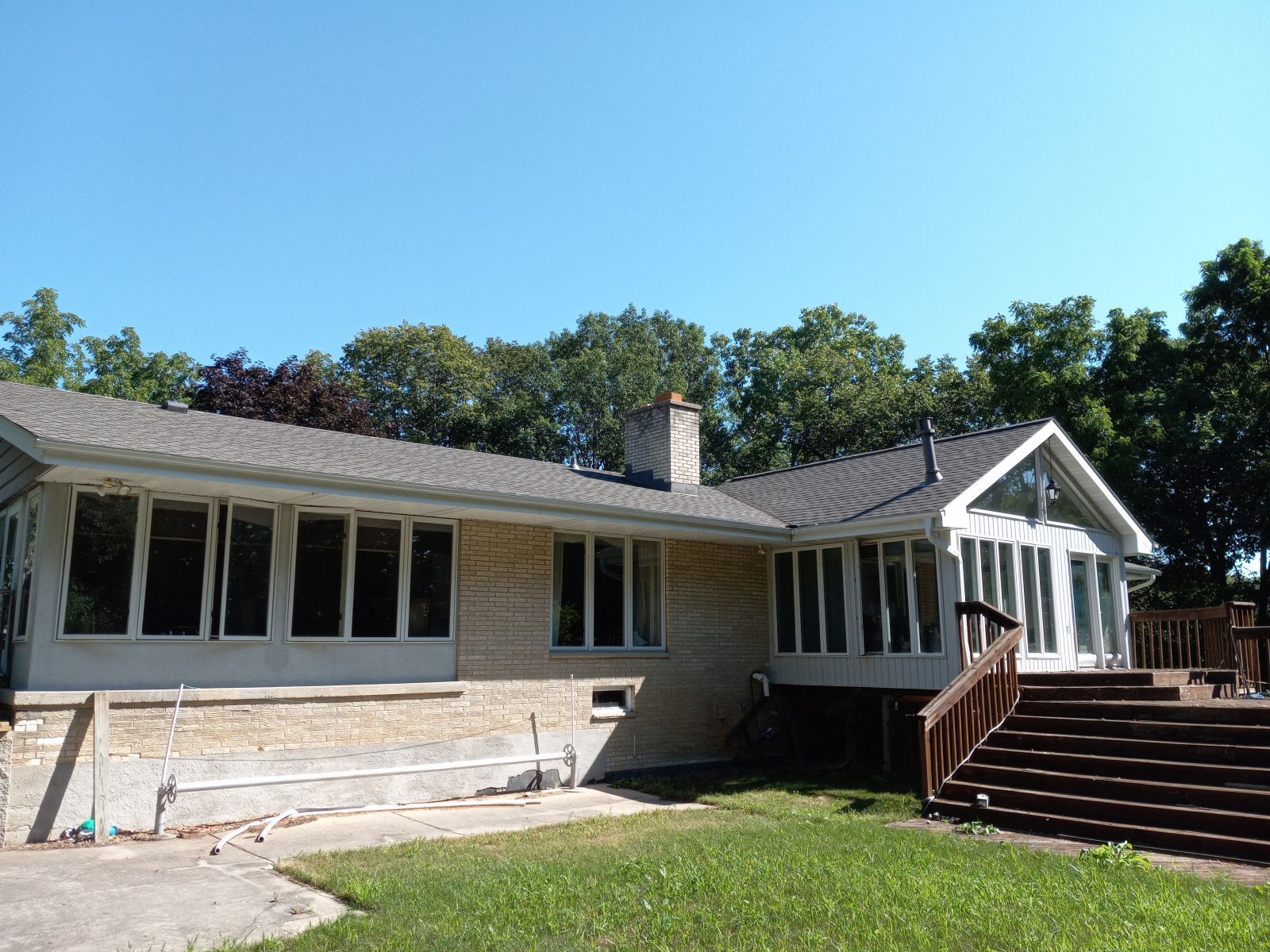A large house with a lot of windows and stairs
