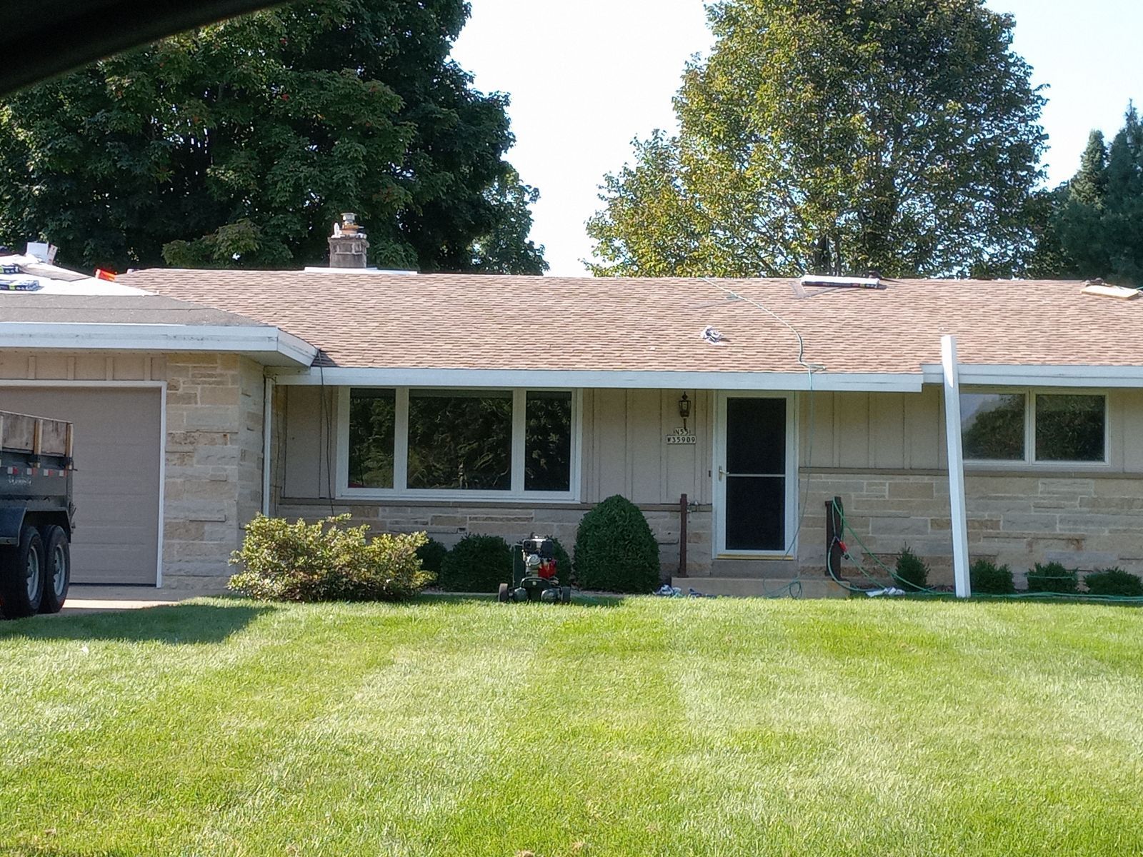 A house with a jeep parked in front of it
