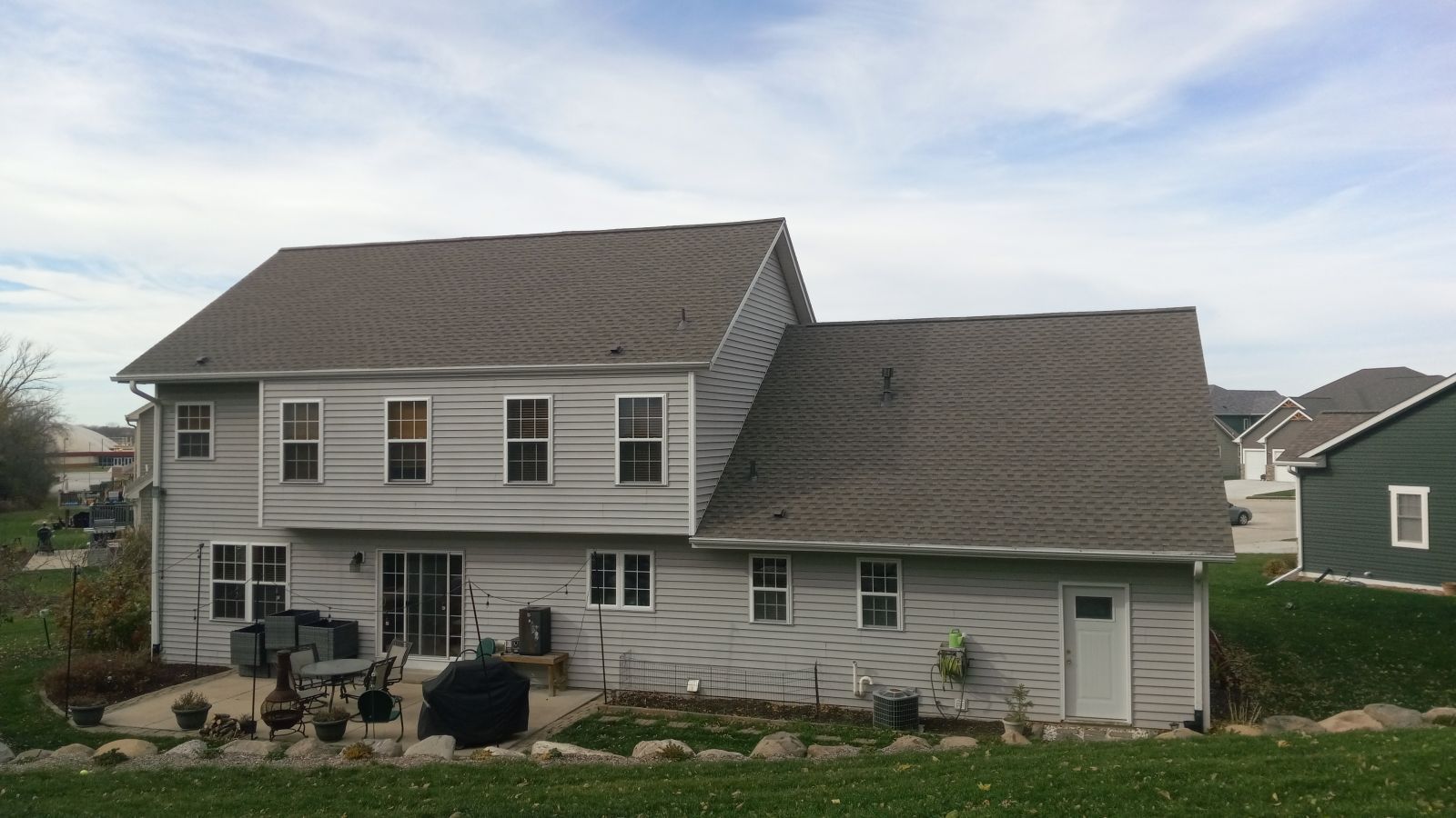 The back of a house with a gray roof