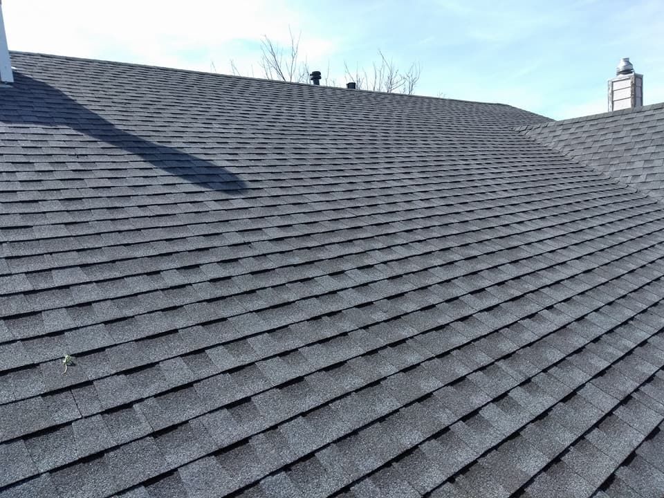 A close up of a roof with shingles on it.