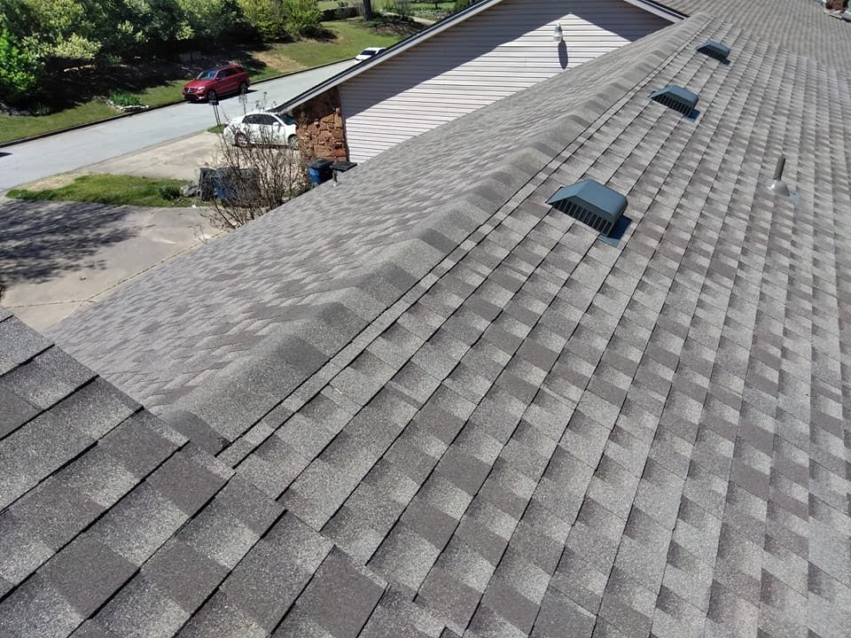 The roof of a house with a lot of shingles on it.