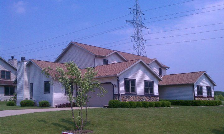 A house with a telephone pole in the background