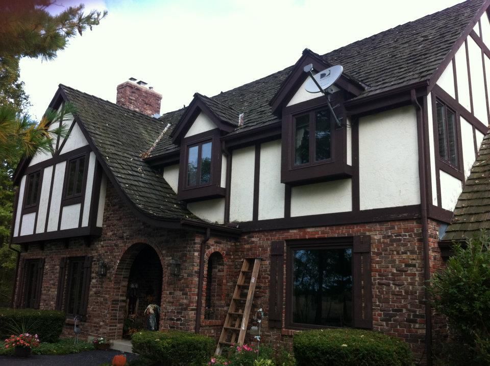 A large house with a ladder in front of it