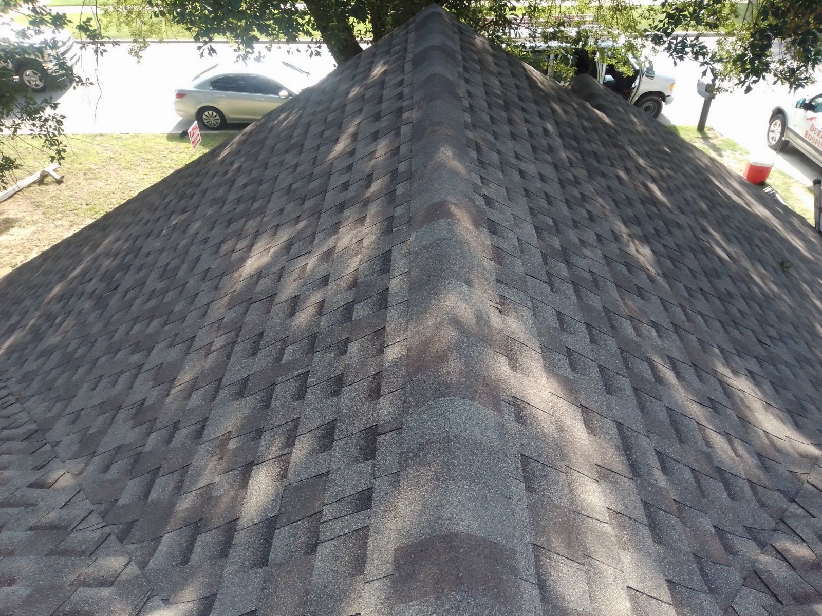 A large pile of shingles on top of a roof