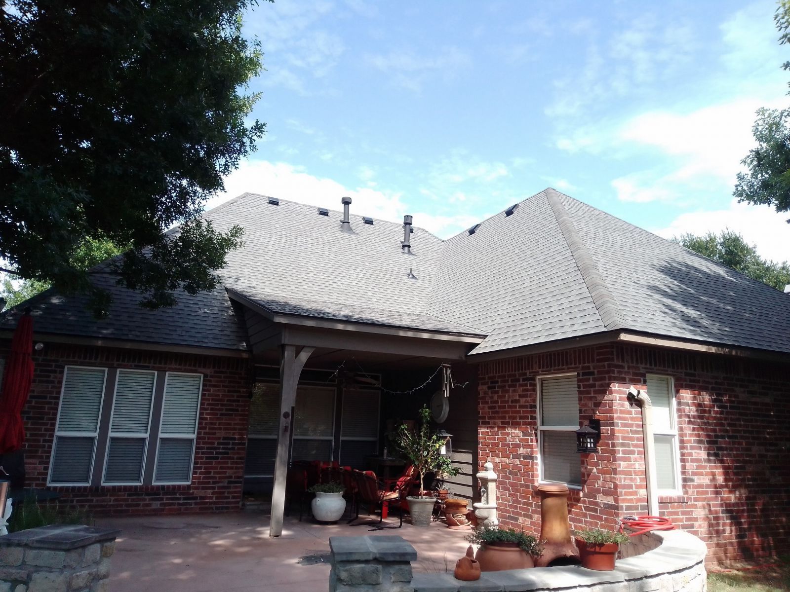 A large brick house with a gray roof