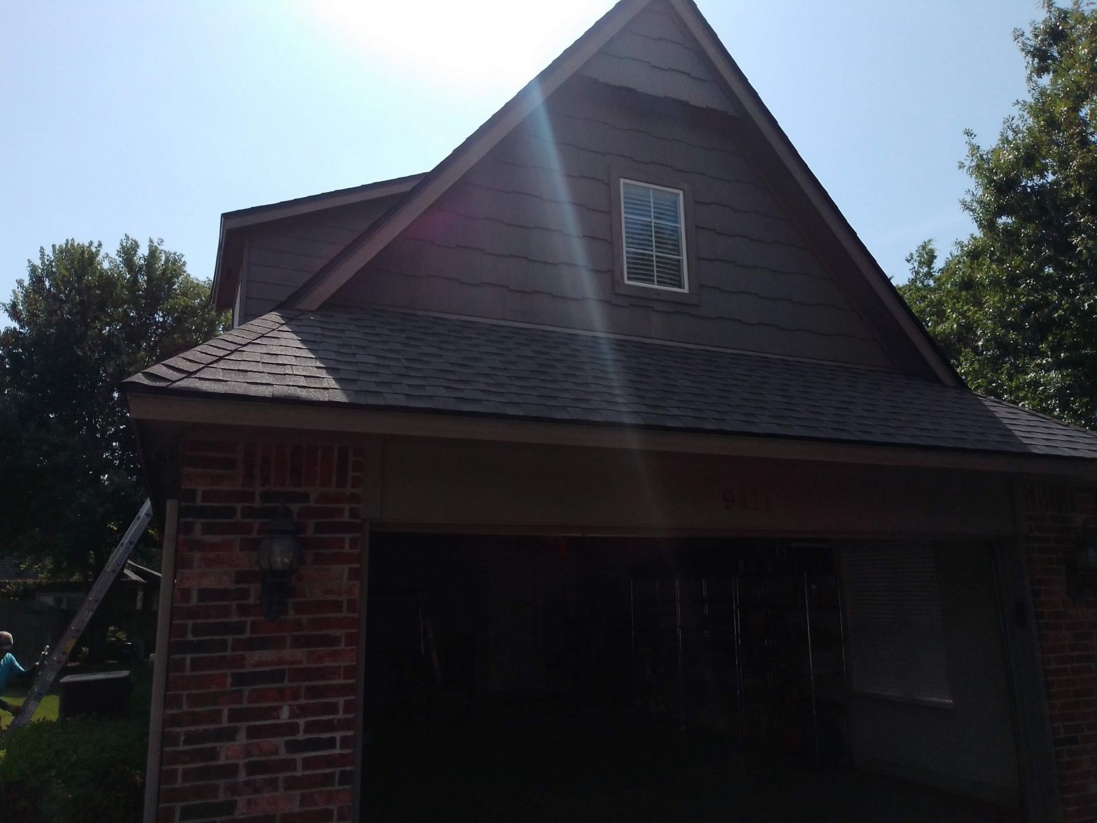 A house with a roof that has a window on it