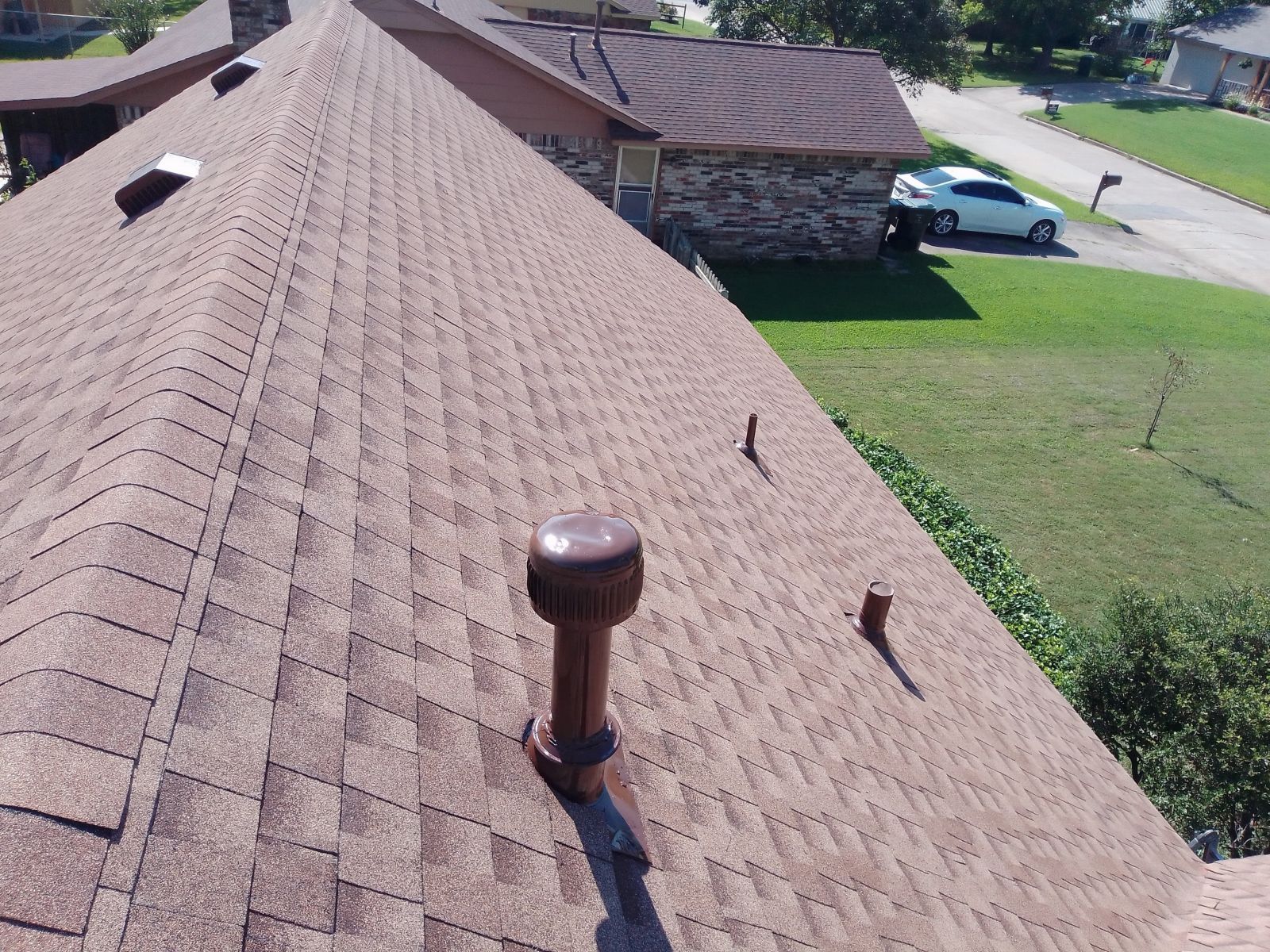 An aerial view of a roof with a chimney on it