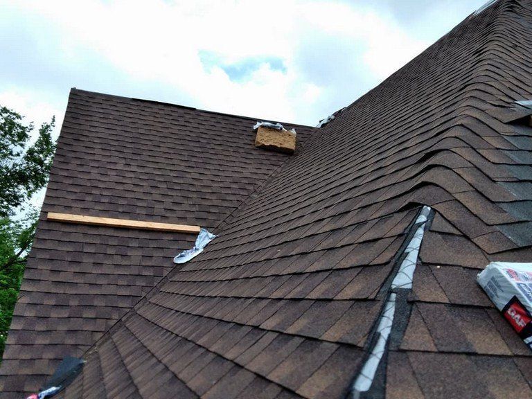 A close up of a roof with shingles on it