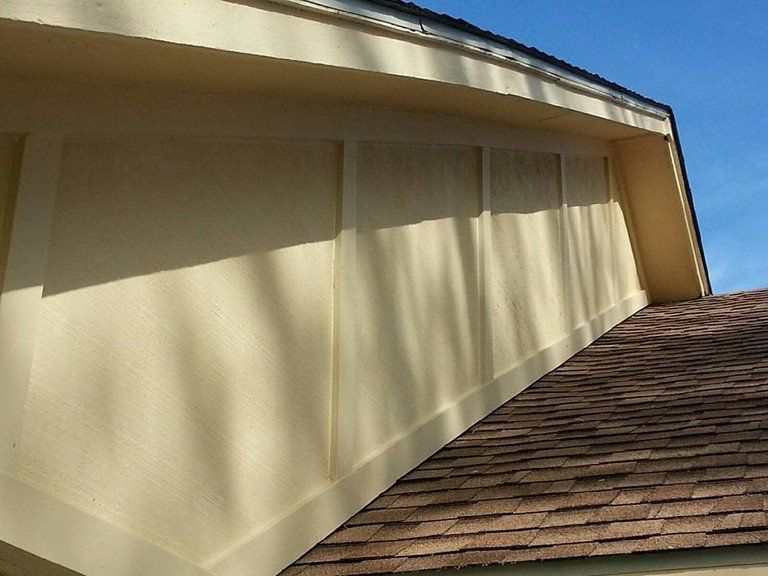A house with a roof that has shingles on it