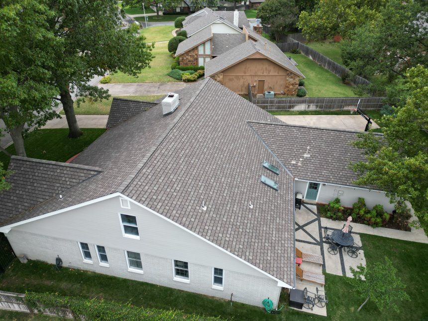 An aerial view of a house with a new roof