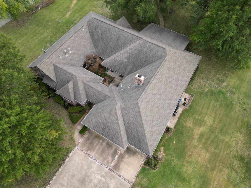 An aerial view of a house with a roof that looks like a volcano.