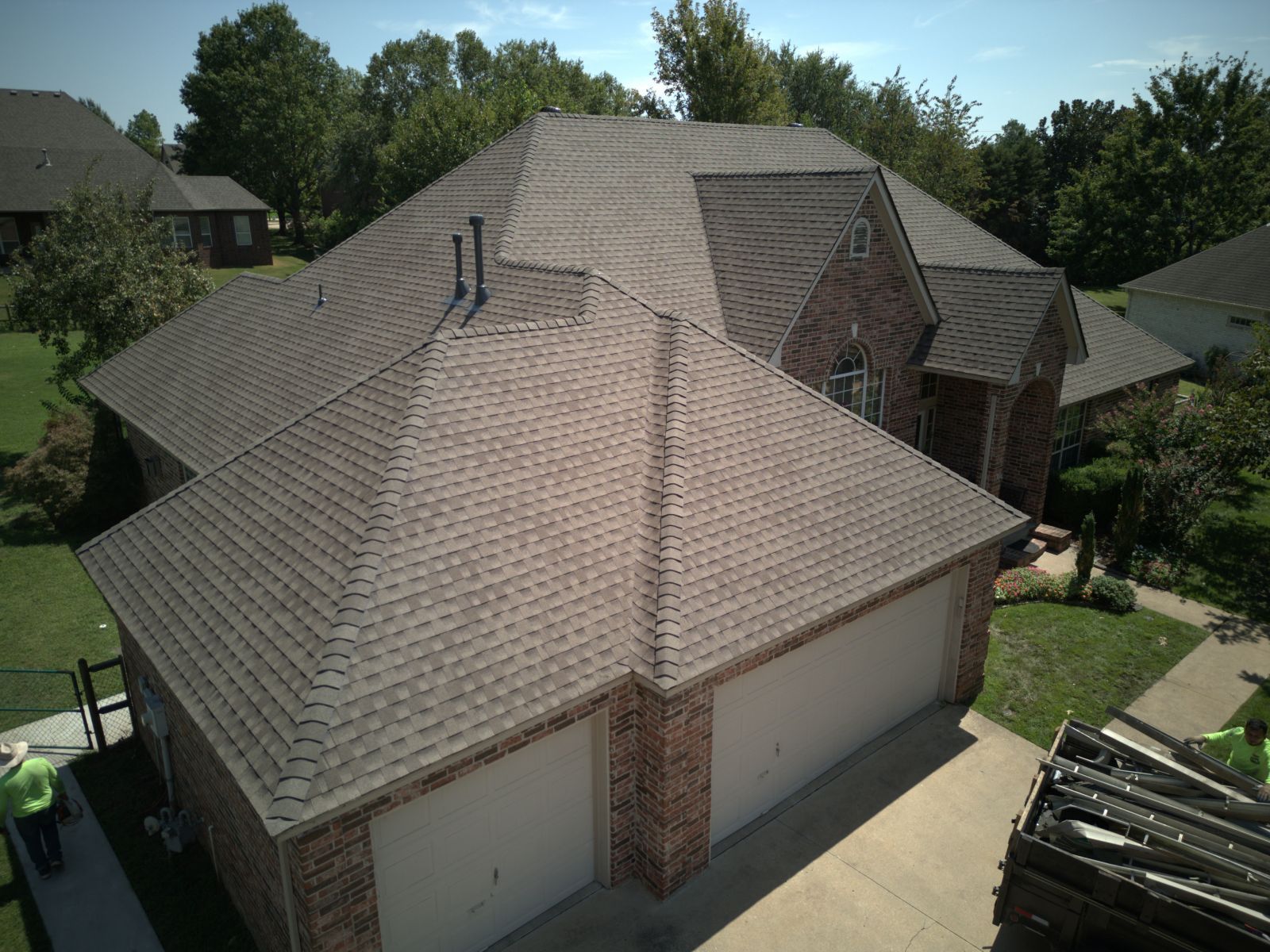 An aerial view of a house with a new roof