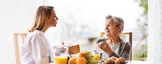 caregiver and an old woman
