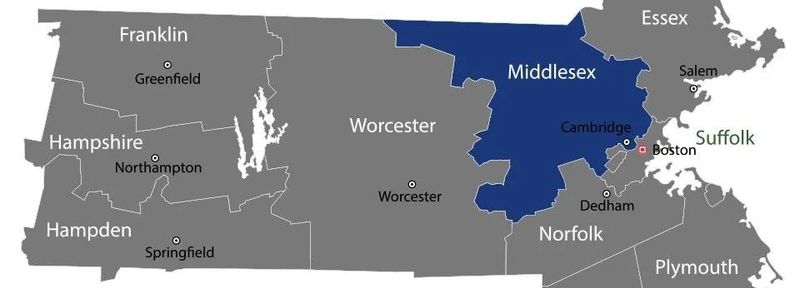 Map of New England counties with one Massachusetts county highlighted in blue and labeled towns nearby