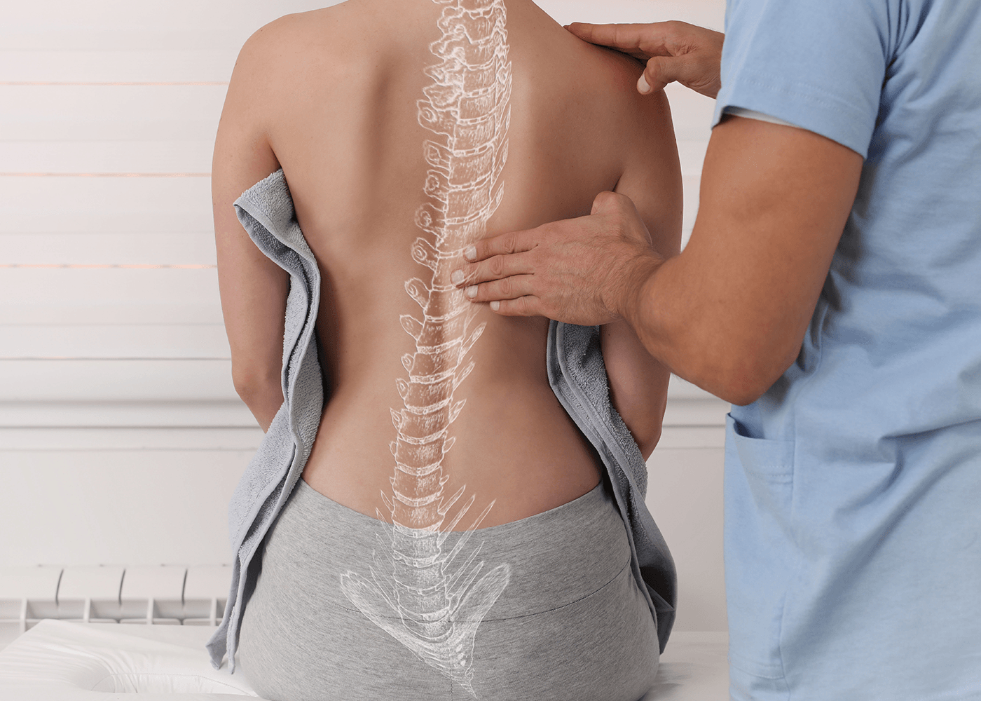 Adjusting spinal of a woman