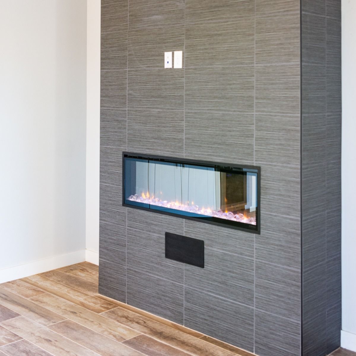 A fireplace is built into a wall in a living room.