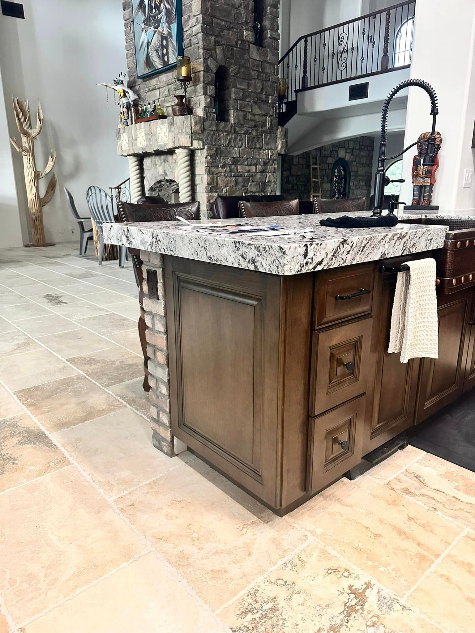 A kitchen with a large island in the middle of the room.