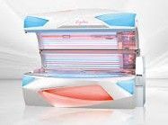 Tanning bed with white and blue accents, interior with UV lights.