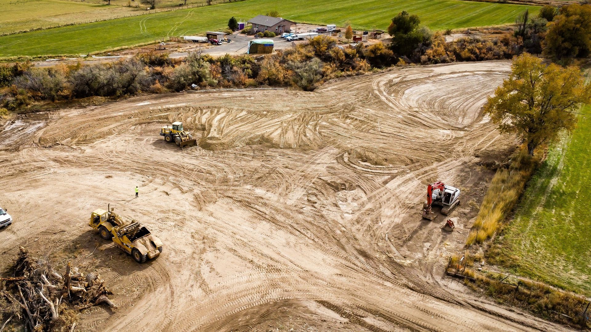 An aerial view of a construction site with a lot of dirt and machinery.