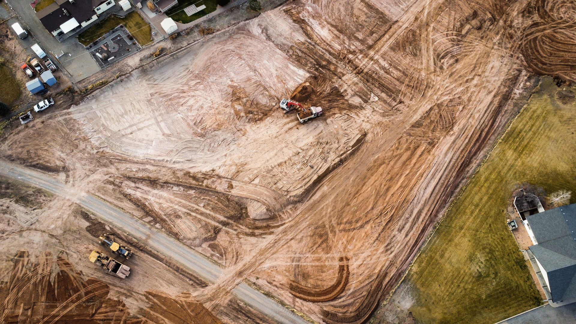An aerial view of a construction site with a lot of dirt.