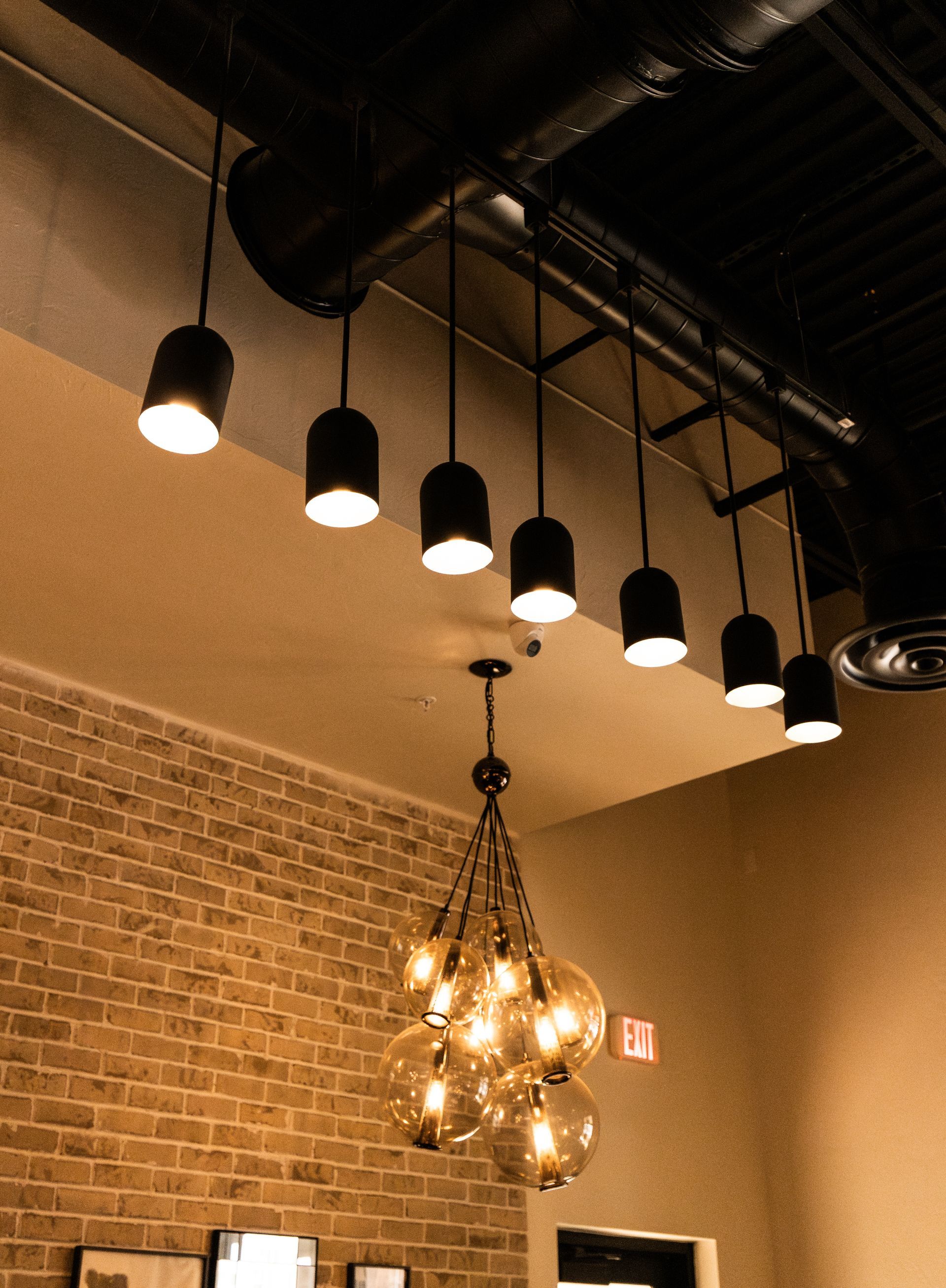 A ceiling with a bunch of lights hanging from it