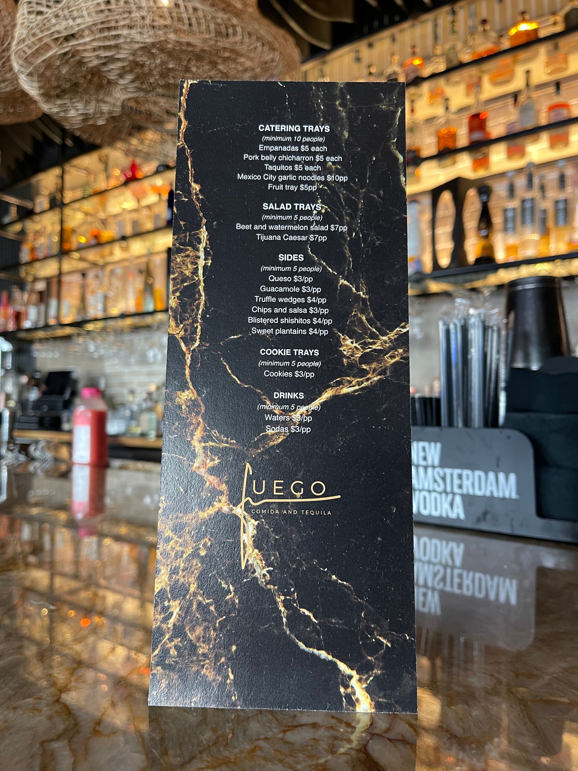 A black and gold sign that says vero on it