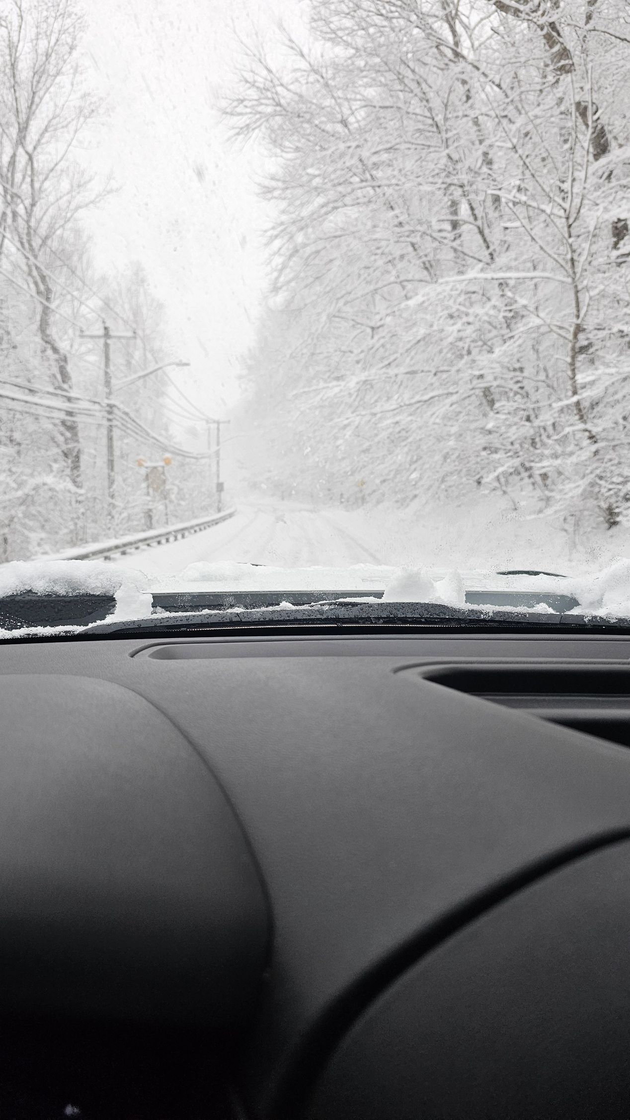 inside truck view of snow outside