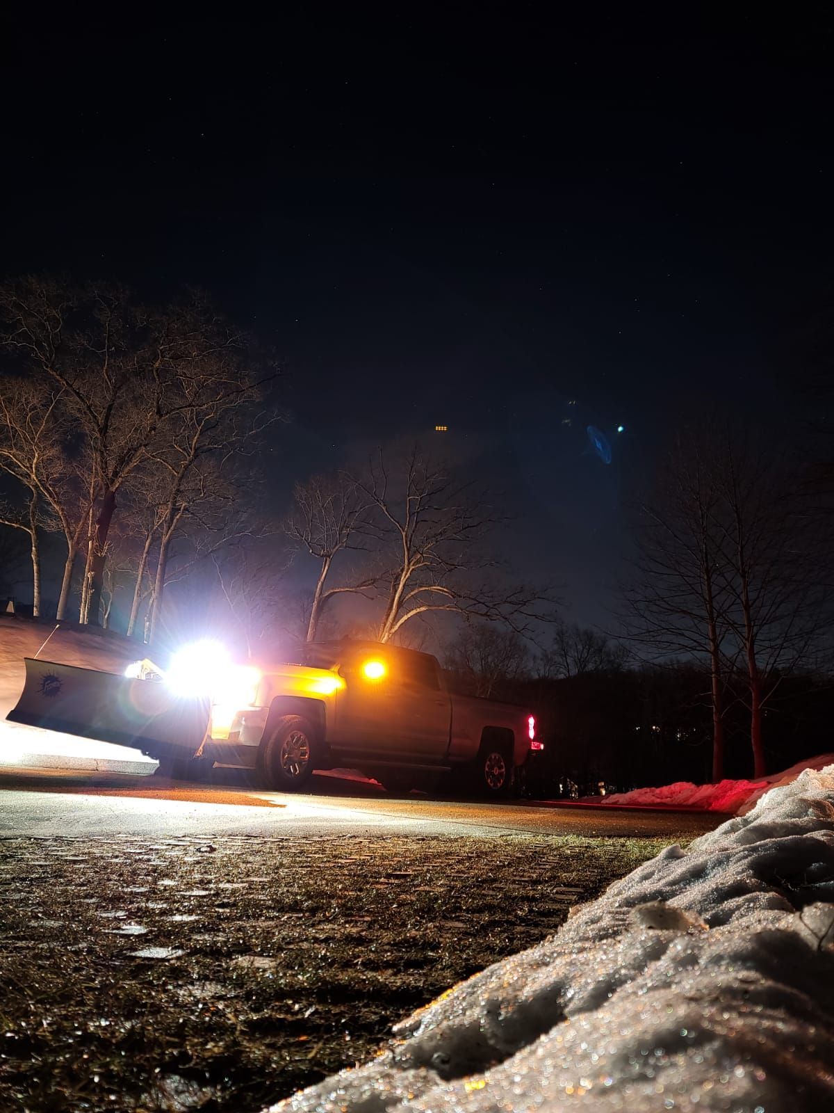 snow removal truck at night