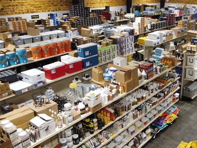 Shelves in a store filled with lots of boxes and bottles