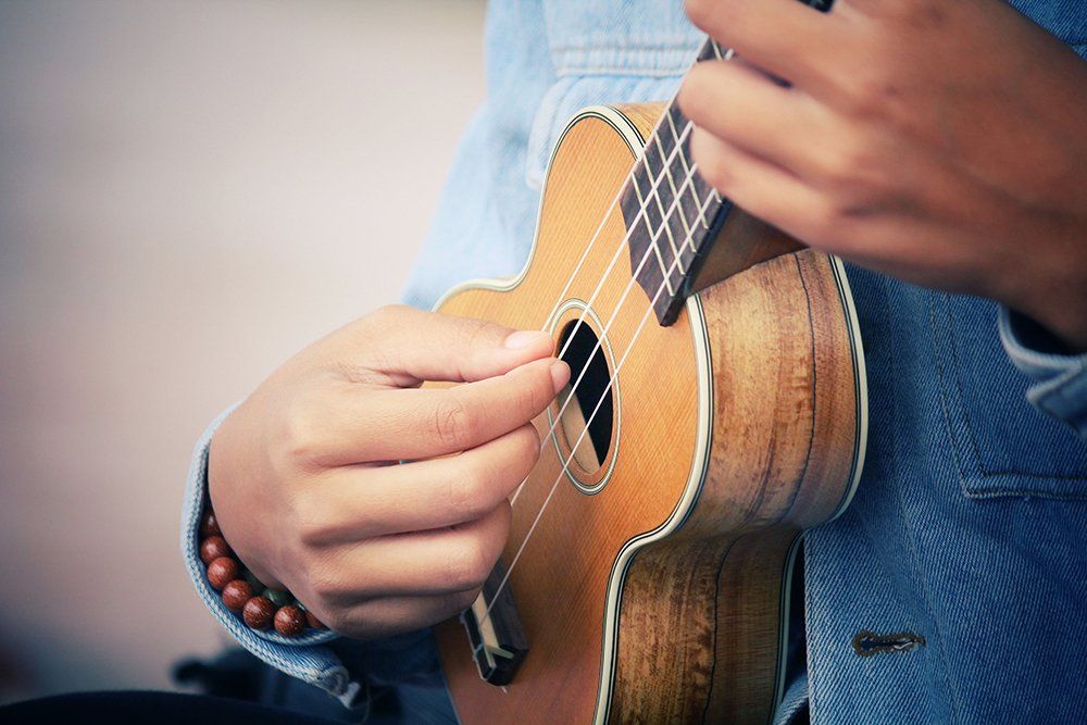 Man playing the ukulele